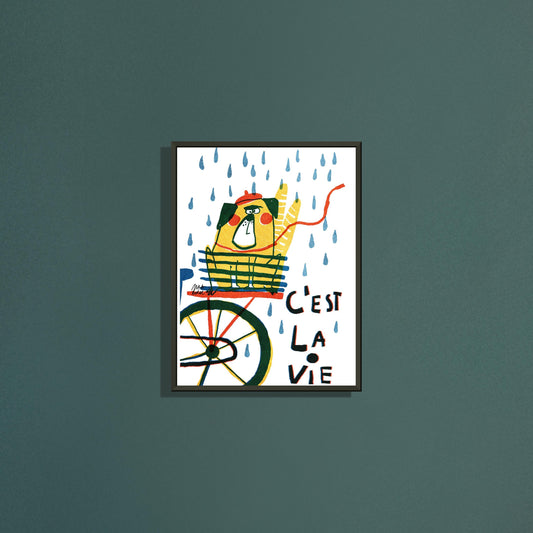 C'est la vie A4 art print by Magda Brol in a black metal frame on a dark green wall