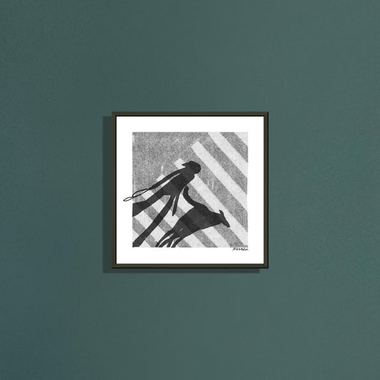 Zebra square art print by Magda Brol in a black metal frame on a dark green wall